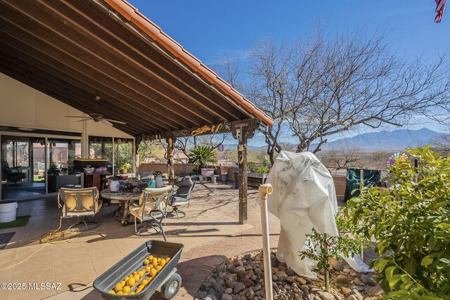 3910 S Via Del Ruisenor, Green Valley, AZ 85622 - view of patio / terrace with ceiling fan and a mountain view