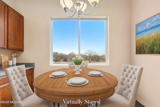 dining space featuring a chandelier