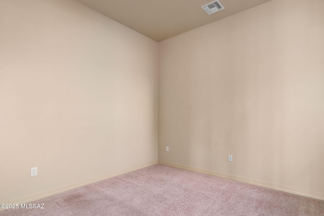 empty room featuring carpet floors