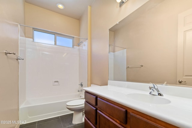 full bathroom with washtub / shower combination, vanity, toilet, and tile patterned flooring