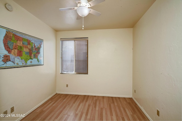 empty room with ceiling fan and light wood-type flooring