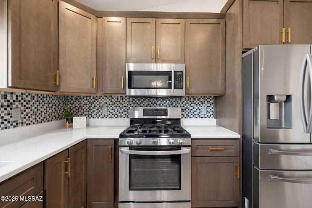 kitchen with backsplash and stainless steel appliances