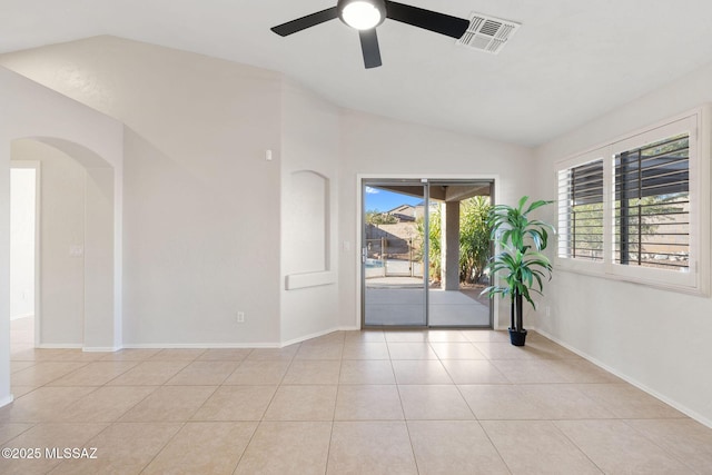 spare room featuring light tile patterned flooring, ceiling fan, and lofted ceiling