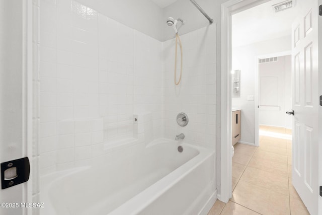 bathroom with tile patterned floors and  shower combination