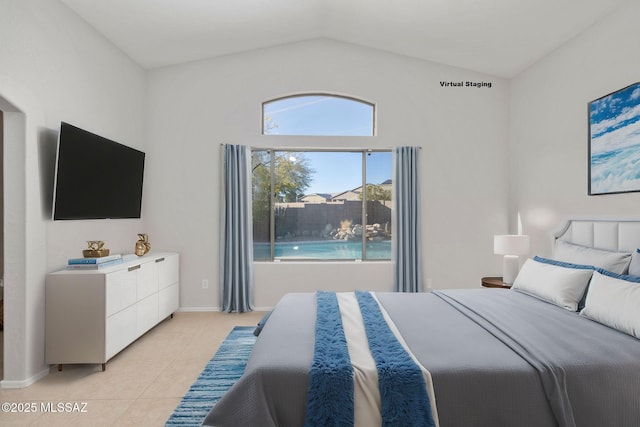 bedroom featuring vaulted ceiling and light tile patterned floors