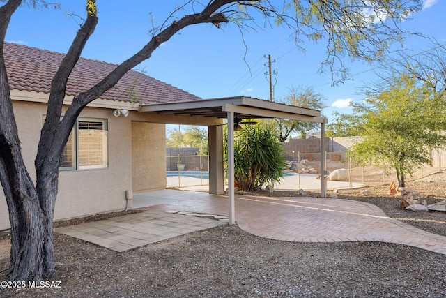 view of patio with a fenced in pool