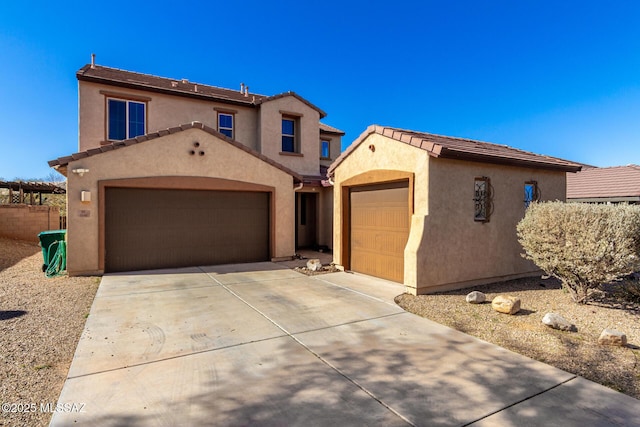 mediterranean / spanish-style home featuring a garage