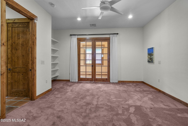 carpeted empty room with ceiling fan and french doors