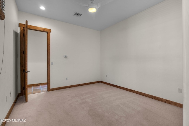 empty room with light colored carpet