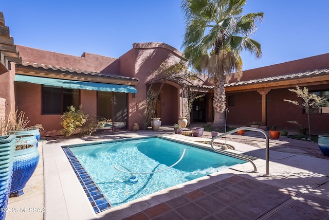 pool with a patio
