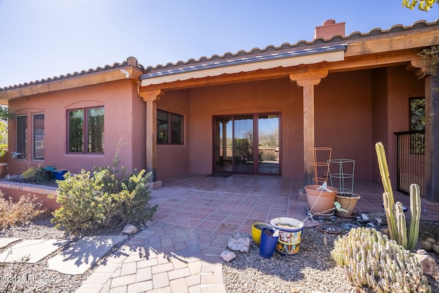 rear view of property featuring a patio area