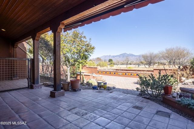 view of patio / terrace with a mountain view