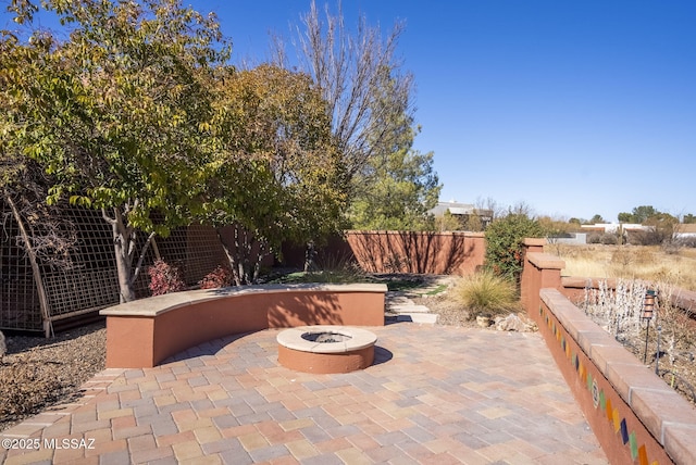 view of patio with an outdoor fire pit