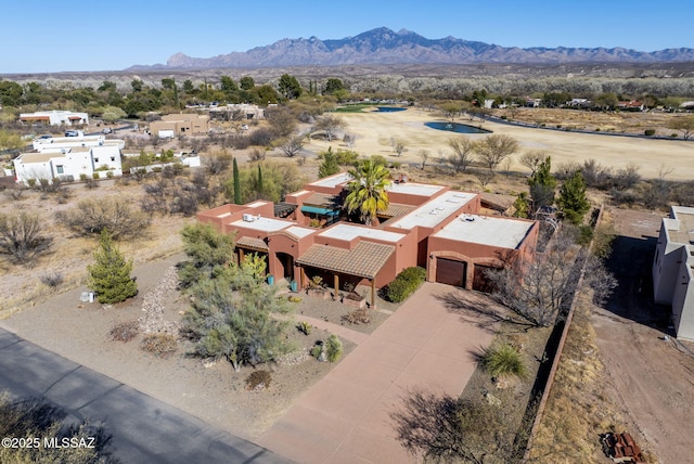 drone / aerial view featuring a mountain view