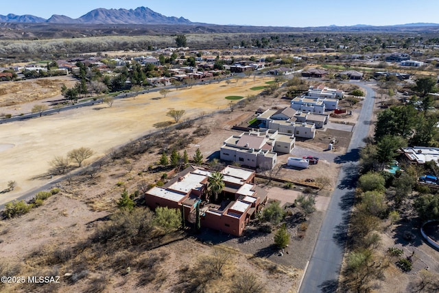 birds eye view of property featuring a mountain view