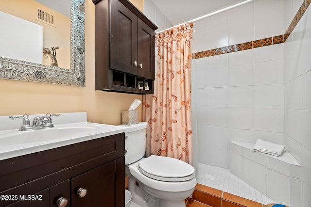 bathroom with vanity, a shower with curtain, and toilet