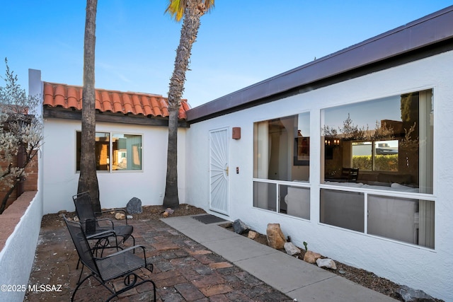 rear view of property featuring a patio