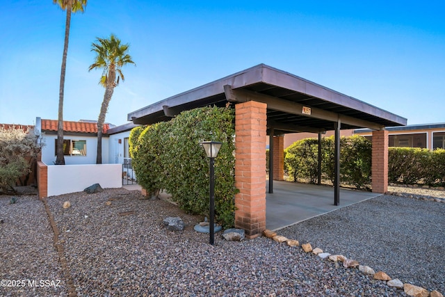 view of property exterior with a carport