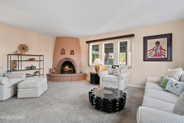 carpeted living room with a fireplace