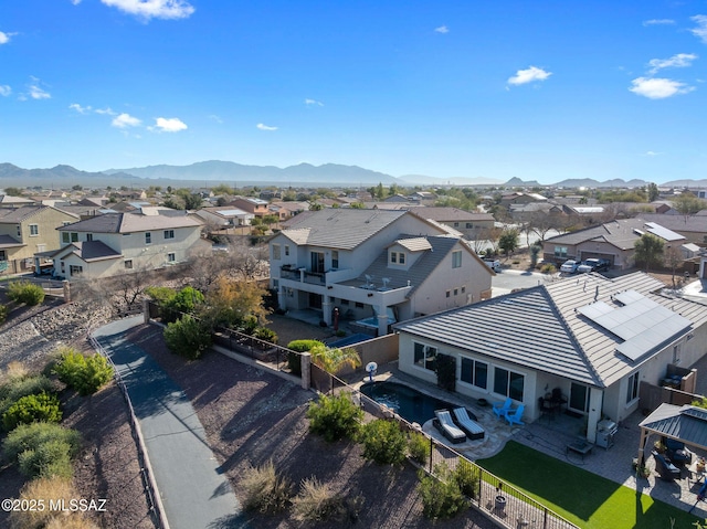 birds eye view of property featuring a mountain view