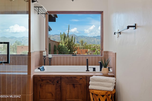 bathroom with a mountain view and a washtub