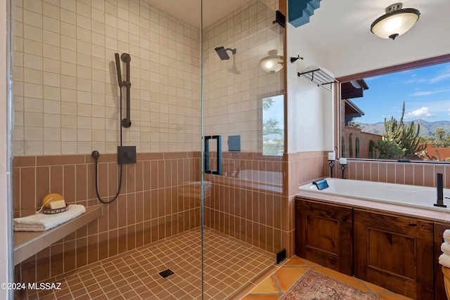 bathroom with tile patterned floors and separate shower and tub