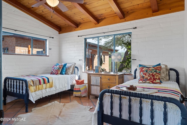 tiled bedroom with lofted ceiling with beams, brick wall, and wooden ceiling