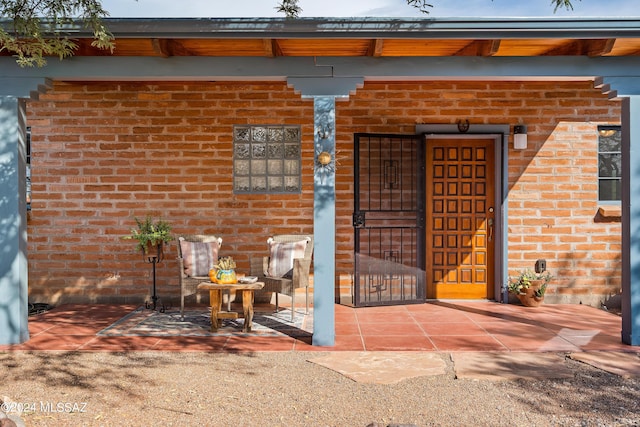 doorway to property featuring a patio