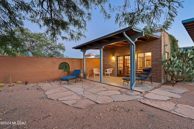 back of house with a patio and french doors