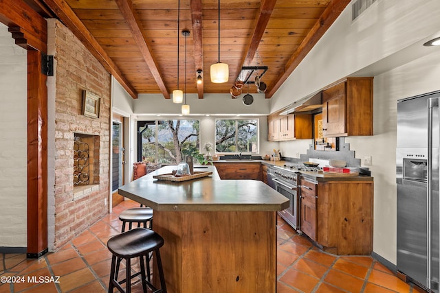 kitchen with pendant lighting, premium appliances, a breakfast bar area, and wooden ceiling