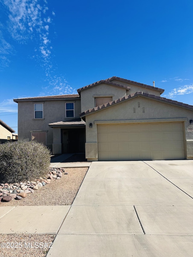 view of front of home with a garage