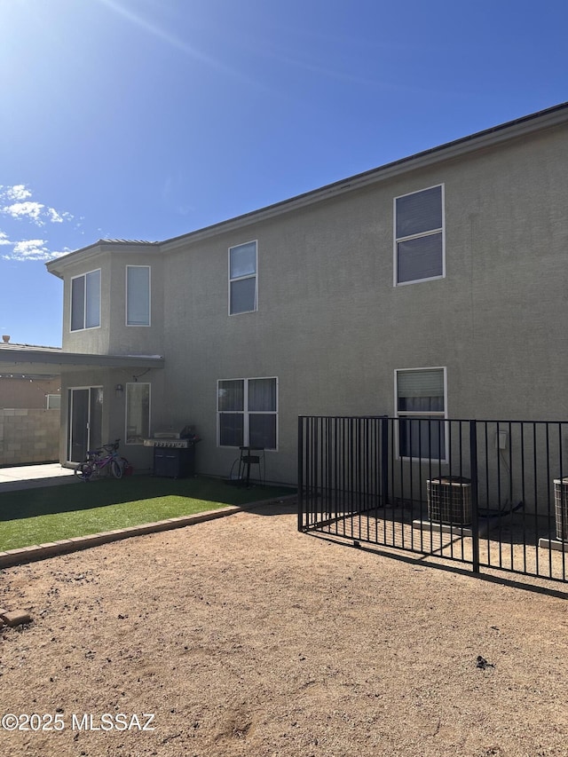 back of property with a patio area