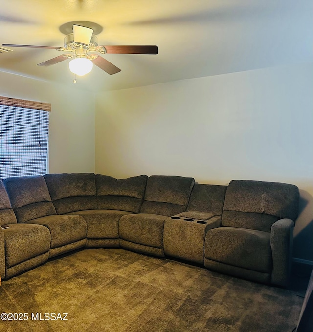 carpeted living room featuring ceiling fan