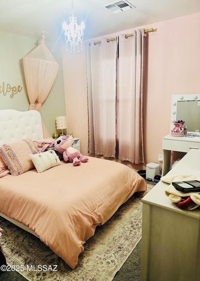 bedroom with a chandelier