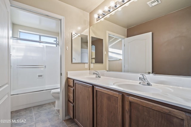 full bathroom with enclosed tub / shower combo, vanity, toilet, and tile patterned floors