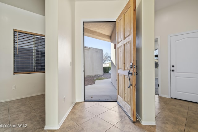 entrance foyer with light tile patterned floors