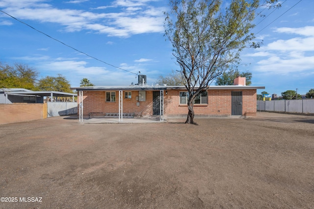 view of front of house with a patio area