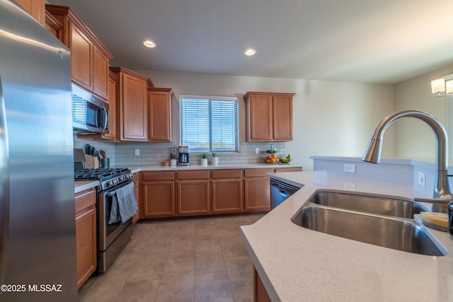 kitchen featuring tasteful backsplash, sink, tile patterned flooring, and appliances with stainless steel finishes