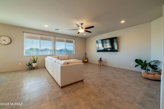 living room with tile patterned flooring and ceiling fan