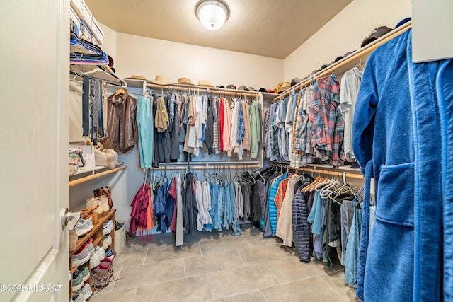 spacious closet with tile patterned flooring