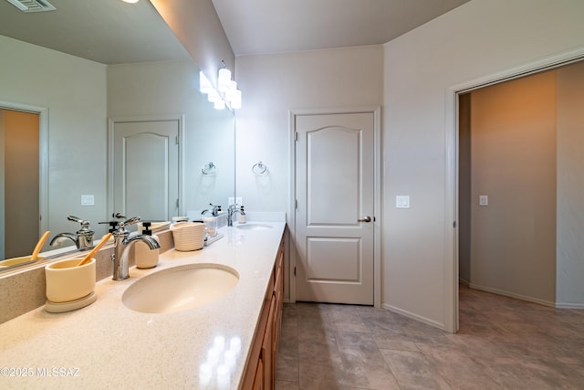 bathroom featuring vanity and tile patterned flooring