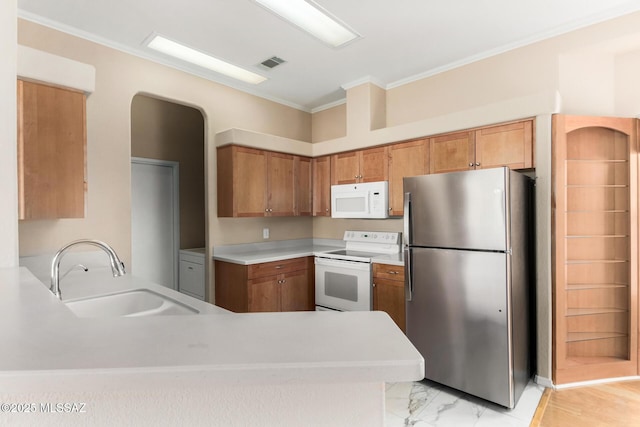 kitchen with crown molding, white appliances, kitchen peninsula, and sink