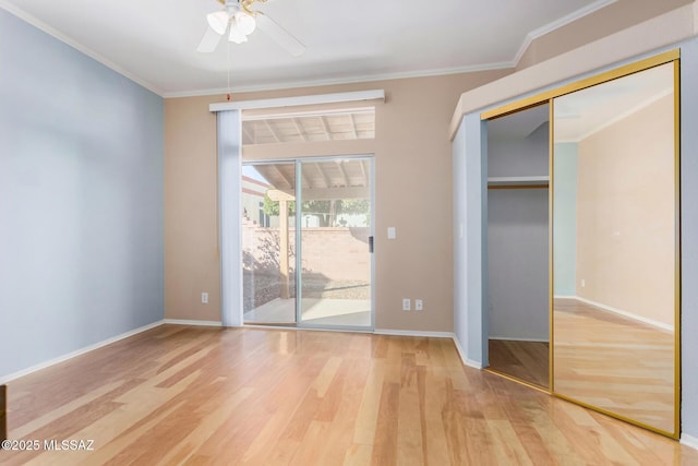 unfurnished bedroom featuring hardwood / wood-style floors, crown molding, access to outside, and ceiling fan