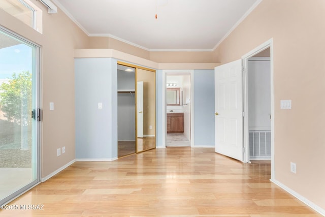 unfurnished bedroom with ensuite bath, light hardwood / wood-style flooring, ornamental molding, and access to outside