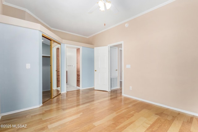 unfurnished bedroom with hardwood / wood-style flooring, ceiling fan, and ornamental molding