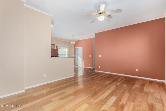 unfurnished room with hardwood / wood-style flooring, ornamental molding, and ceiling fan