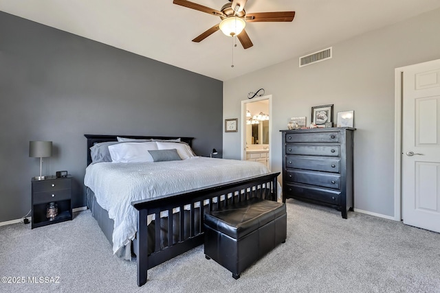 bedroom with ceiling fan, connected bathroom, and carpet floors