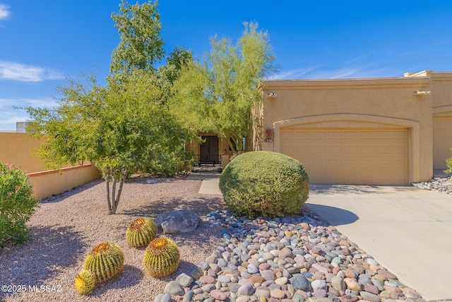 southwest-style home with a garage