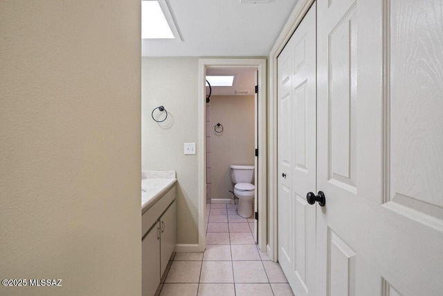 bathroom with vanity, tile patterned floors, and toilet