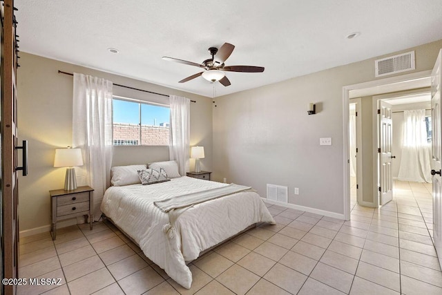 bedroom featuring light tile patterned floors and ceiling fan